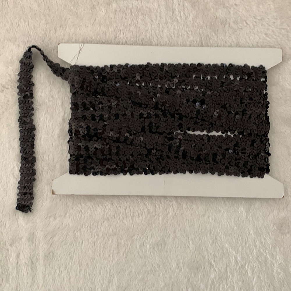 Stretch Sequins trim, 3/4” wide, approx. 9 1/2 yds continuous, black.